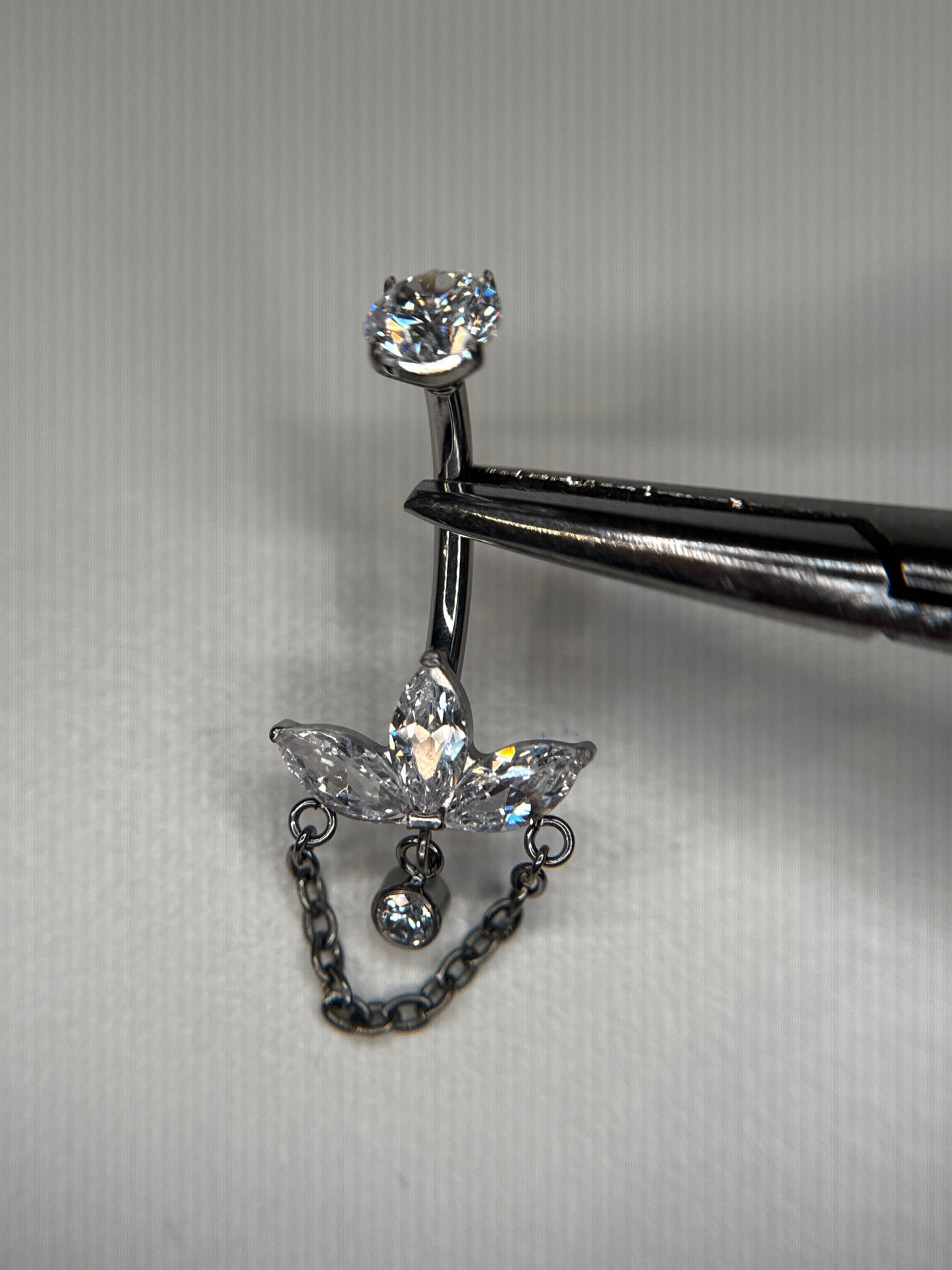 Crown belly dangle chain